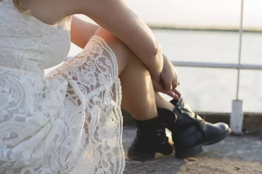 How to pair boots with a dress